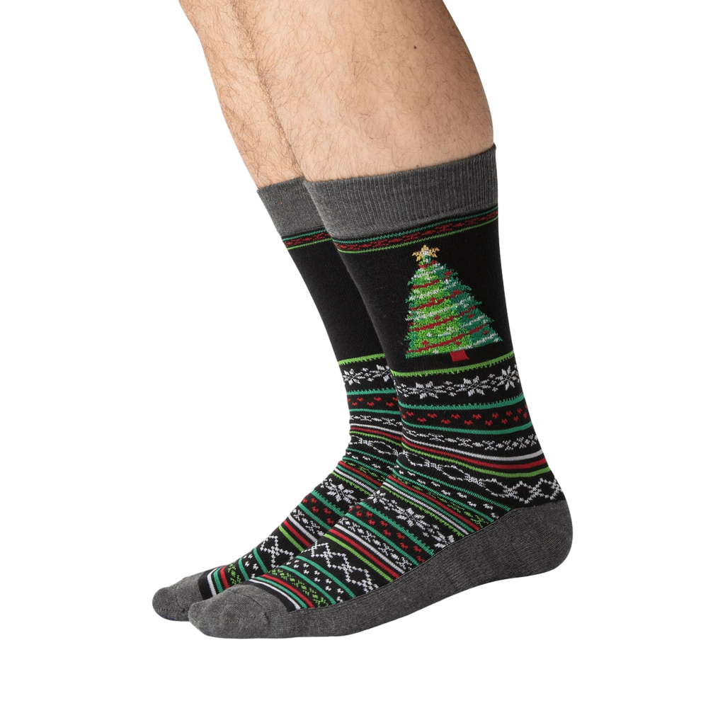Lifestyle shot showing the Christmas tree slipper socks on a person's feet.