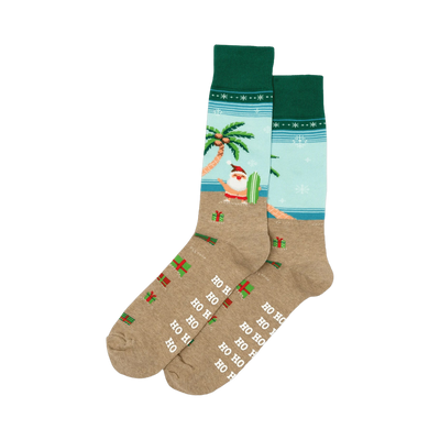 Pair of crew socks. Tan base with a light blue beach scene, surfing Santa, palm tree, presents, and 'Ho Ho Ho' print. Red and green cuffs.