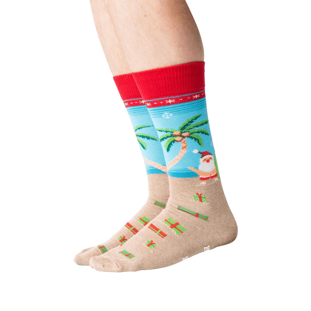 Lifestyle shot of a person's legs wearing the Surfing Santa socks.