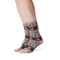 Lifestyle shot showing the Thanksgiving Fairisle socks on a person's legs.