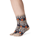 Lifestyle shot showing the Thanksgiving Fairisle socks on a person's legs.