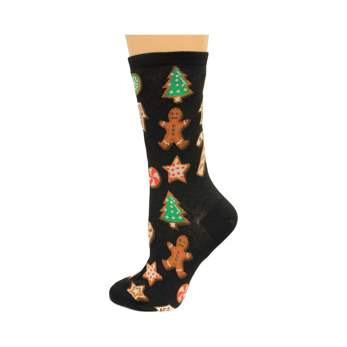 Black crew socks with a fun Christmas cookie pattern.  Gingerbread men, candy canes, stars, and Christmas trees are featured in red, green, and brown. }}