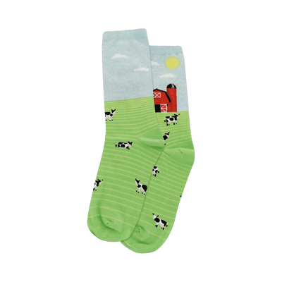 Crew socks with a light blue sky, red barn, and green field with black and white cows. 