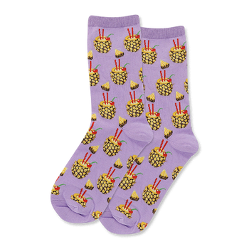 Pair of crew socks with a soft lavender background, patterned with yellow pineapple drinks, red straws, cherries, and pineapple slices.