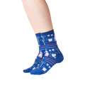 Lifestyle shot showing the Dentist socks on a person's legs against a black background.