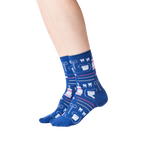 Lifestyle shot showing the Dentist socks on a person's legs against a black background.