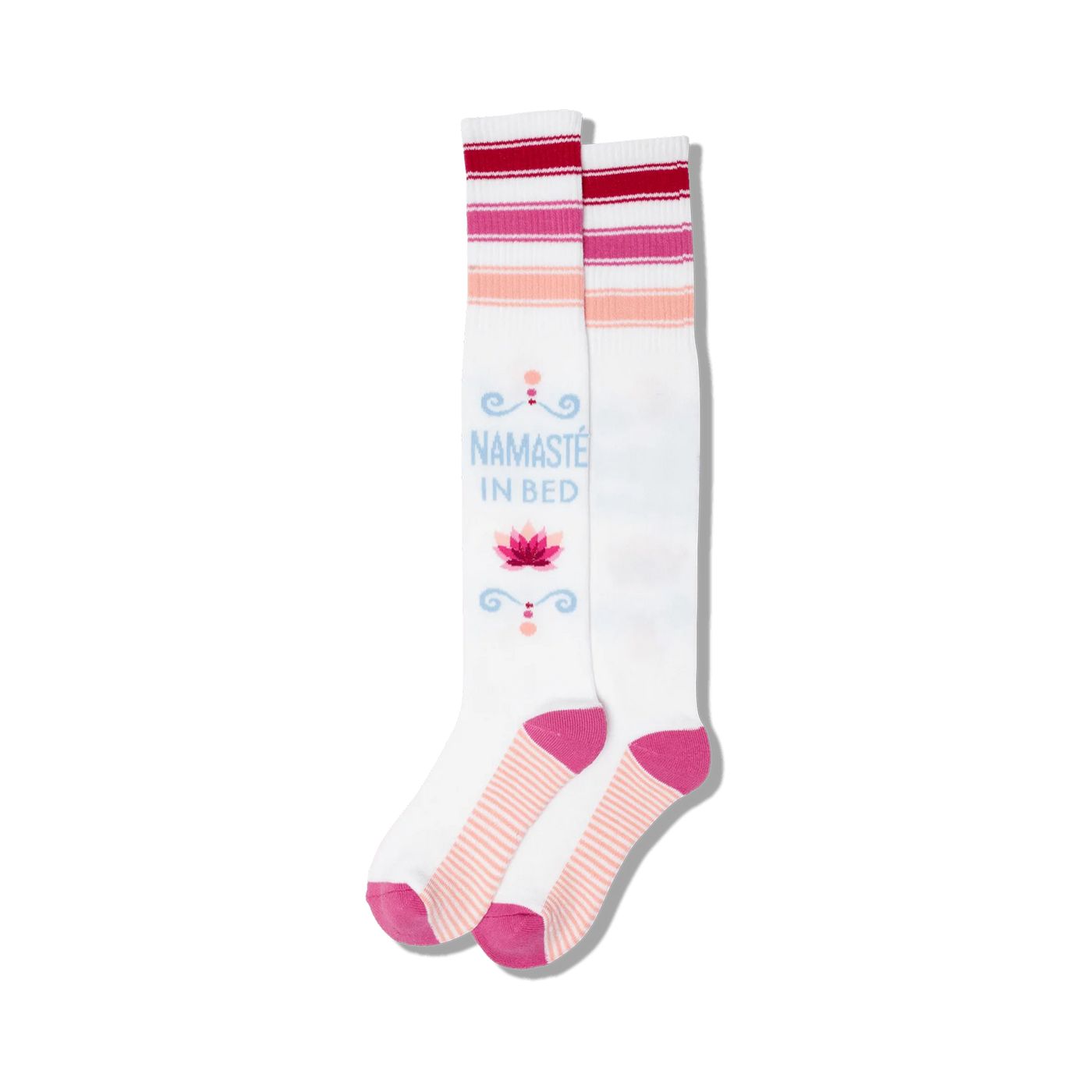 Pair of white knee-high socks with pink and red stripes, a lotus flower, and 'Namaste In Bed' text.