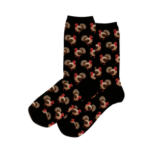 Pair of black crew socks with a repeating pattern of brown and red turkeys. 