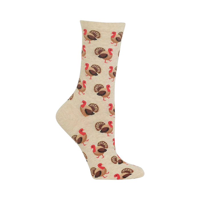 Close-up of a beige crew sock with a repeating pattern of brown and red turkeys.