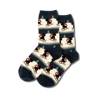 dark blue crew socks with a pattern of scottie dogs sledding down a snowy hill.   