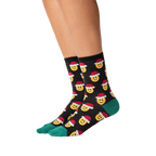 Lifestyle shot of a person wearing the Santa Smile Emoji socks. Shows how the socks look on the feet.