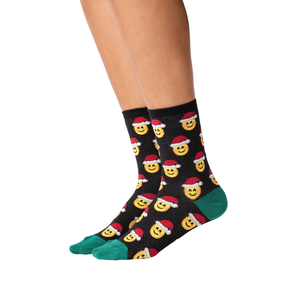 Lifestyle shot of a person wearing the Santa Smile Emoji socks. Shows how the socks look on the feet.
