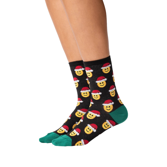 Lifestyle shot of a person wearing the Santa Smile Emoji socks. Shows how the socks look on the feet.