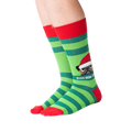 Lifestyle shot showing the socks on a person's feet.  The socks are green and red striped with a pug graphic.