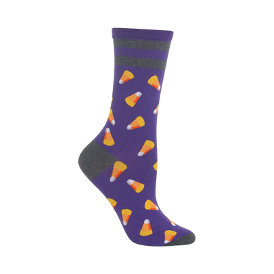 Crew socks in purple with a gray cuff and toe.  The socks feature a repeating pattern of small, illustrated candy corn.
