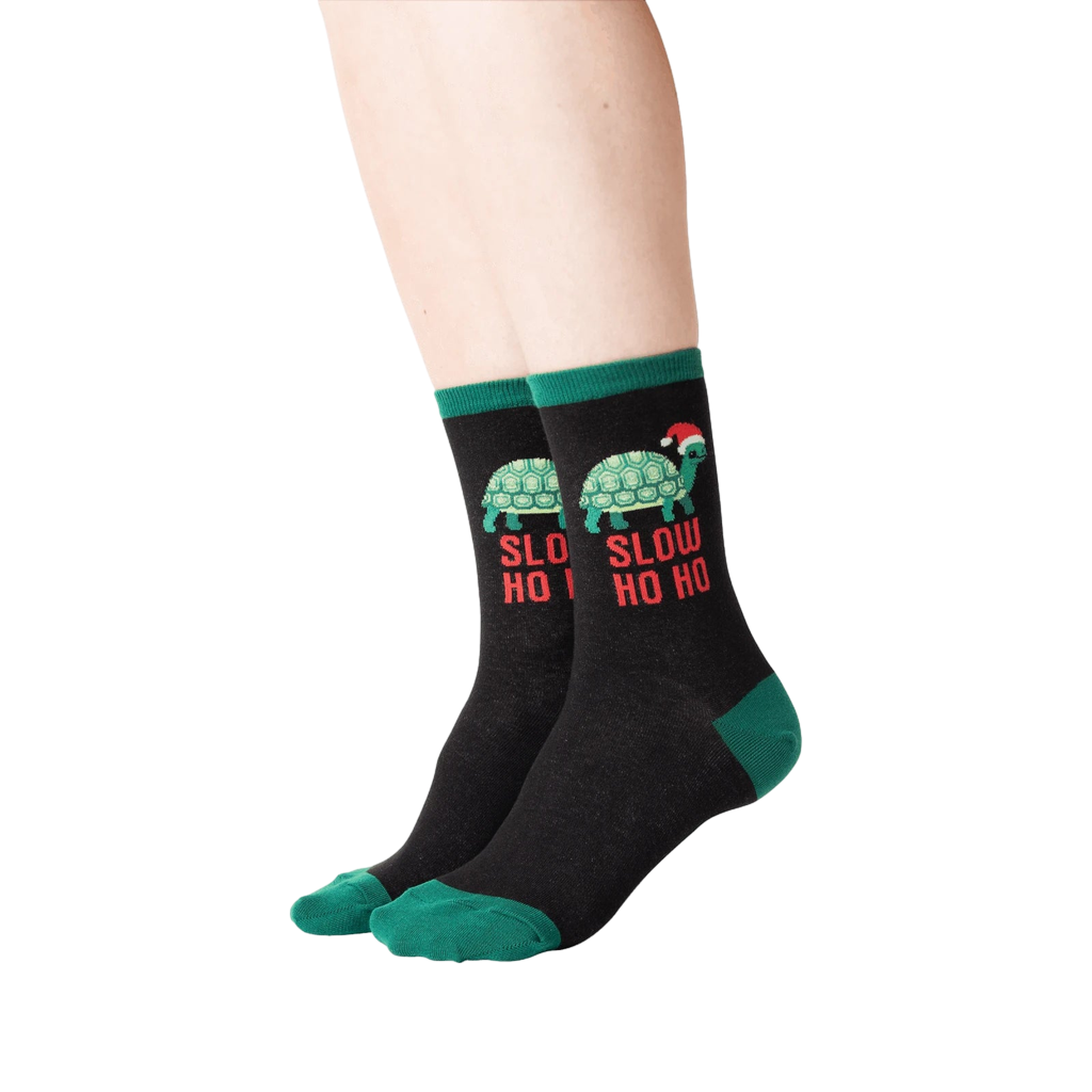 Lifestyle shot of a person wearing the 'Slow Ho Ho' socks, showcasing the fit and design.
