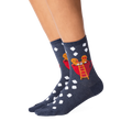 Lifestyle shot showing the Gingerbread Couple socks on a person's legs.  The socks' design is clearly visible.