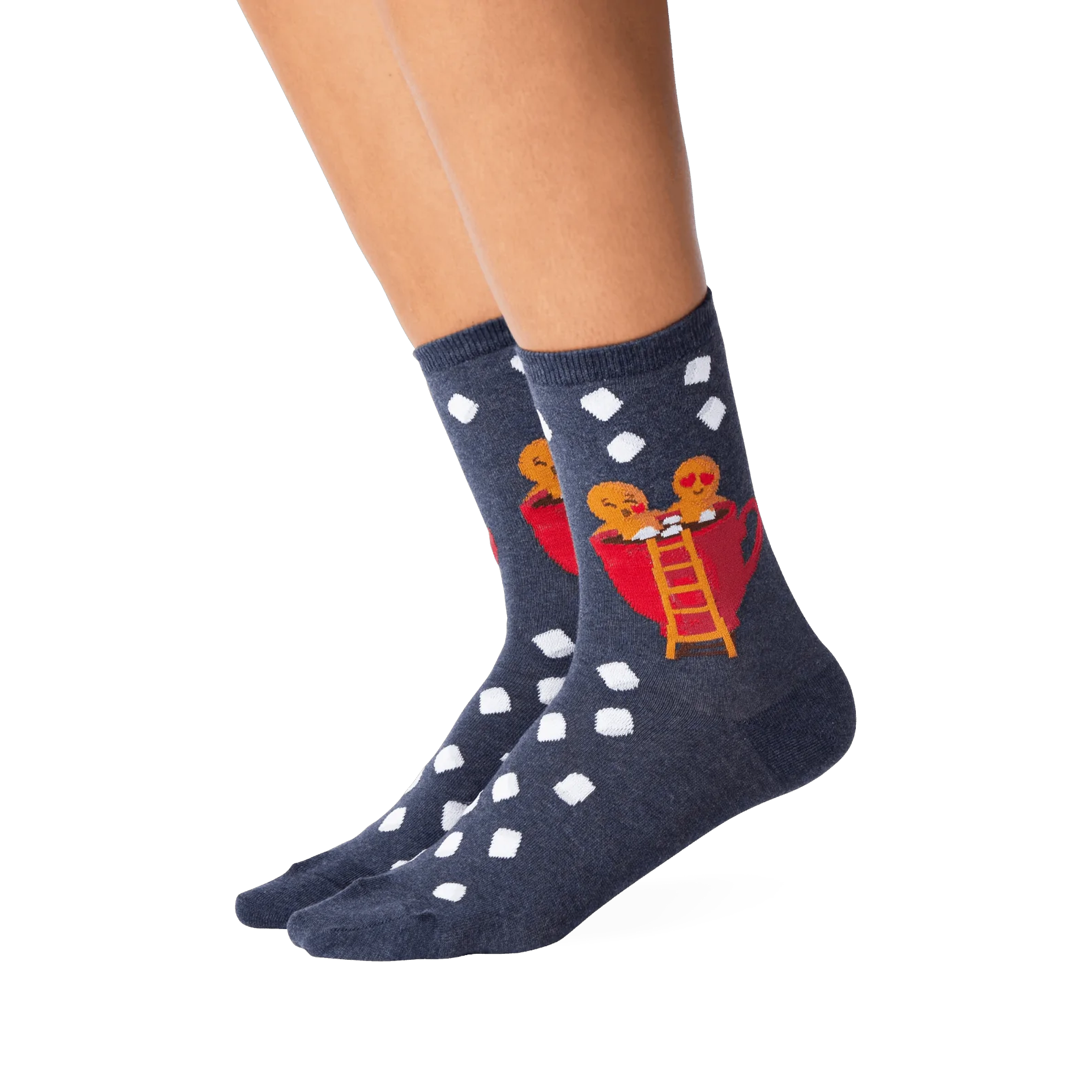 Lifestyle shot showing the Gingerbread Couple socks on a person's legs.  The socks' design is clearly visible.