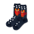 Pair of dark blue crew socks with white polka dots. Features a design of two gingerbread people in a red mug of hot cocoa.
