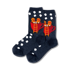 Pair of dark blue crew socks with white polka dots. Features a design of two gingerbread people in a red mug of hot cocoa.