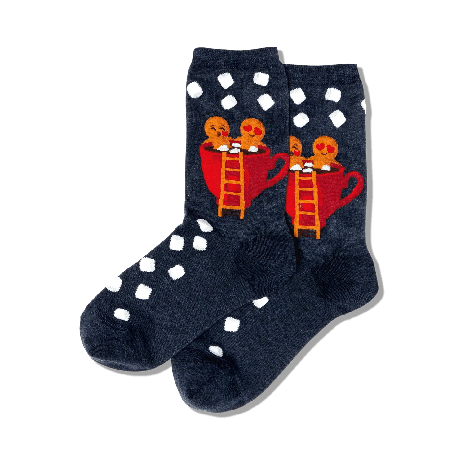 Pair of dark blue crew socks with white polka dots. Features a design of two gingerbread people in a red mug of hot cocoa.