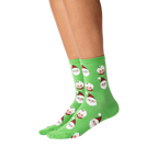 Lifestyle shot: A person's legs wearing the Santa and Mrs. Claus socks against a black background.