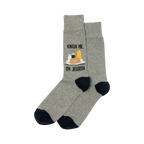 A pair of heather gray crew socks with a navy blue cuff. The socks show a graphic of a knish, mustard, and seasonings with the text 'Knish Me, I'm Jewish'.