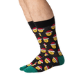 Lifestyle shot of a person wearing the Santa Smile Emoji socks. Shows how the socks look on the foot.
