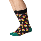 Lifestyle shot of a person wearing the Santa Smile Emoji socks. Shows how the socks look on the foot.
