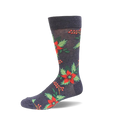 Charcoal grey crew sock with a repeating pattern of red poinsettia flowers, green leaves, and red berries on a white background.