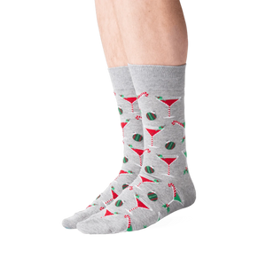 Lifestyle shot of male model wearing grey Christmas Cocktails socks.