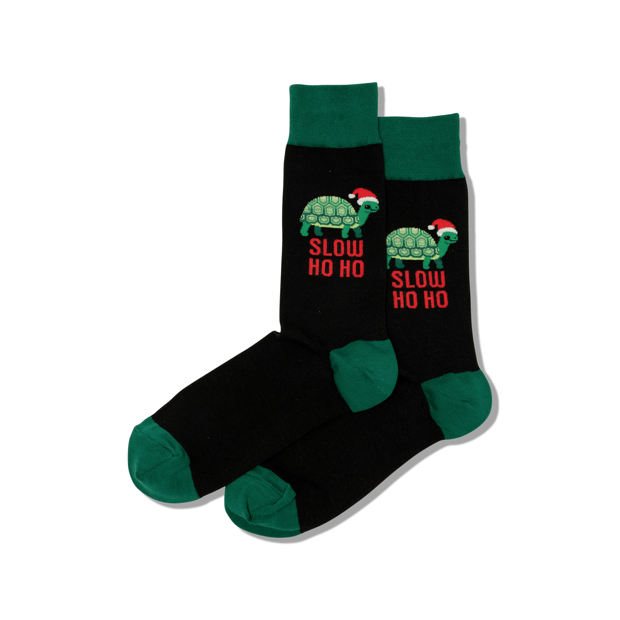 Pair of black crew socks with dark green cuffs, heels, and toes. Features green turtles wearing Santa hats and "SLOW HO HO" text in red.