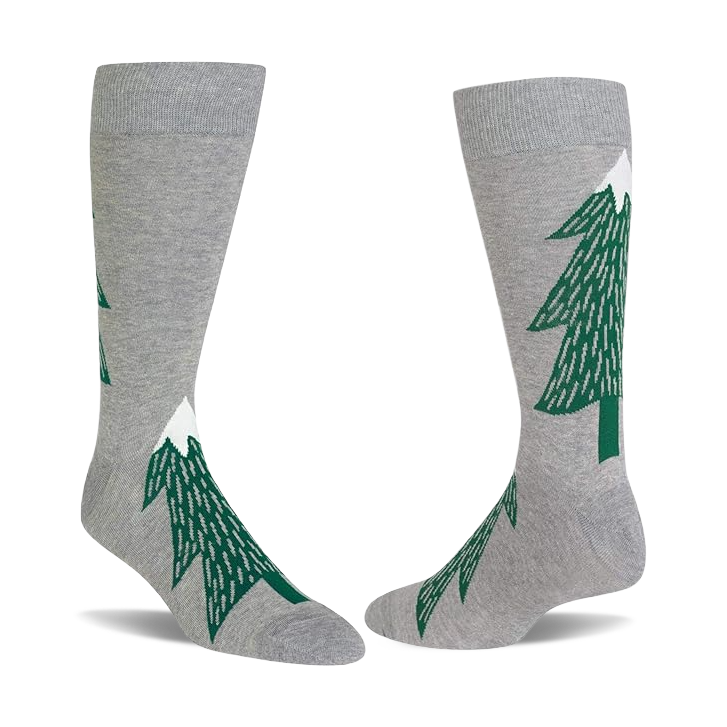 Pair of light gray crew socks with dark green evergreen tree patterns, each tree topped with a white snow peak.