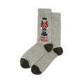 Pair of gray crew socks with a pixelated Nutcracker design and the text 'What's Crackin?' in red.  Dark gray heel and toe.