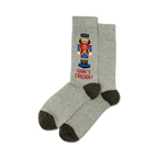 Pair of gray crew socks with a pixelated Nutcracker design and the text 'What's Crackin?' in red.  Dark gray heel and toe.
