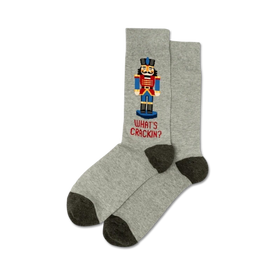 gray and brown christmas crew socks with nutcracker soldier pattern and the words "what's crackin?".   