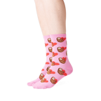 Lifestyle shot: Person wearing pink sloth socks, showcasing the fit and design.