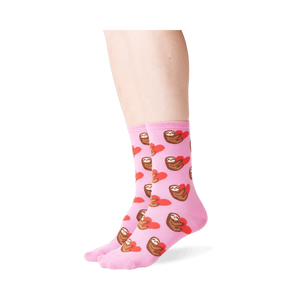 Lifestyle shot: Person wearing pink sloth socks, showcasing the fit and design.