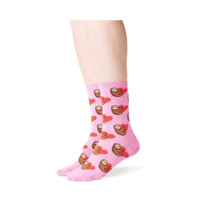 Lifestyle shot: Person wearing pink sloth socks, showcasing the fit and design.