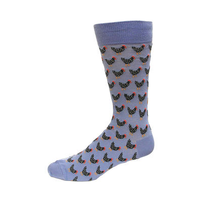 Crew socks in periwinkle blue with a repeating pattern of illustrated black chickens.