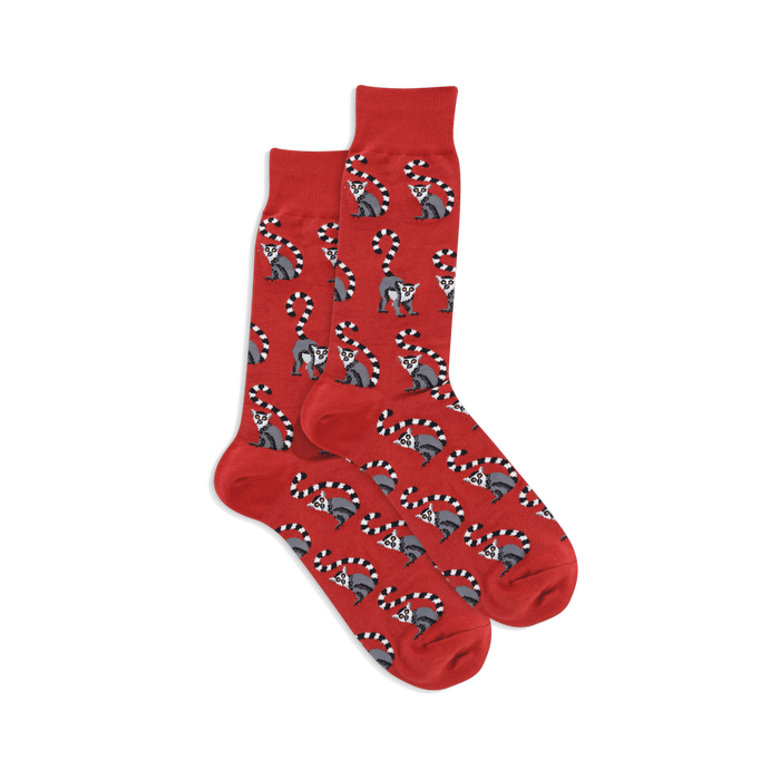 Pair of crew socks in bright red with a repeating pattern of grey and white lemurs with ringed tails. }}