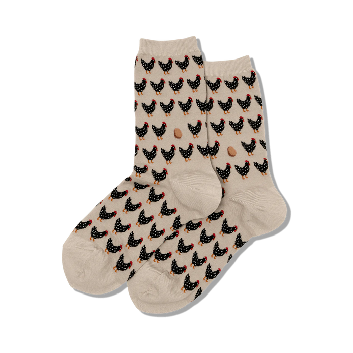 womens crew socks with black chickens, red combs and feet and small brown eggs on beige background. fall theme.    }}