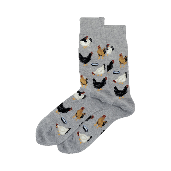 Pair of crew socks; gray and light blue options shown.  Features a repeating pattern of black, brown, and white chickens near small bowls.