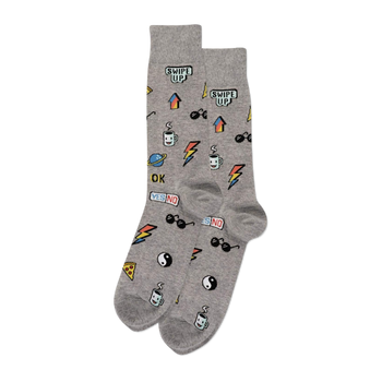 A pair of grey crew socks covered in small, colorful pixelated stickers including "SWIPE UP", sunglasses, and pizza slices.