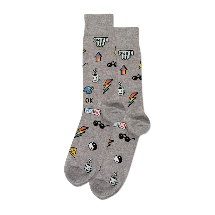 A pair of grey crew socks covered in small, colorful pixelated stickers including 
