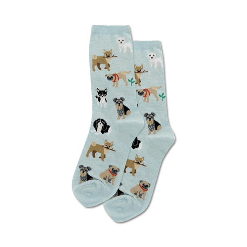 Pair of light blue crew socks with a pattern of various small dogs carrying sticks.  The dogs are in shades of brown, black, and white.