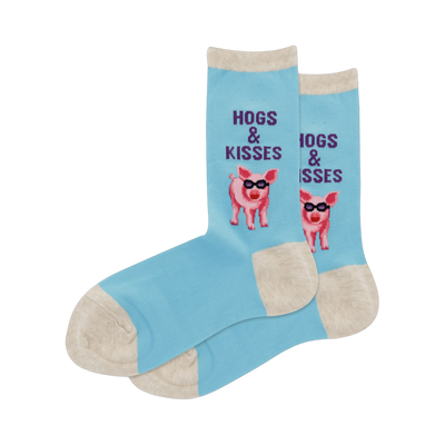 Pair of light blue crew socks with a pattern of pink pigs wearing sunglasses and the text 'Hogs & Kisses'.