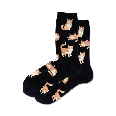 black crew socks with an allover pattern of cartoon cats in orange with white paws and a pink bow.  