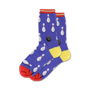 bowling stripe socks in women's crew length display white bowling pin and black bowling ball pattern on a blue background with red and yellow stripe accents.  