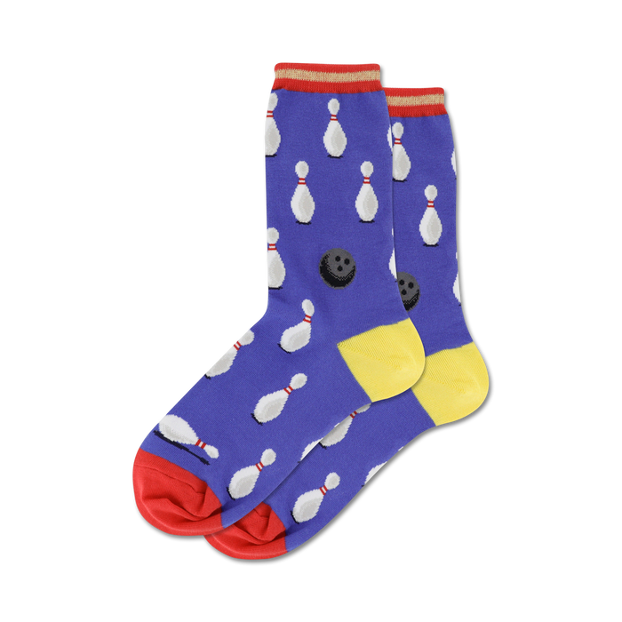 bowling stripe socks in women's crew length display white bowling pin and black bowling ball pattern on a blue background with red and yellow stripe accents.  